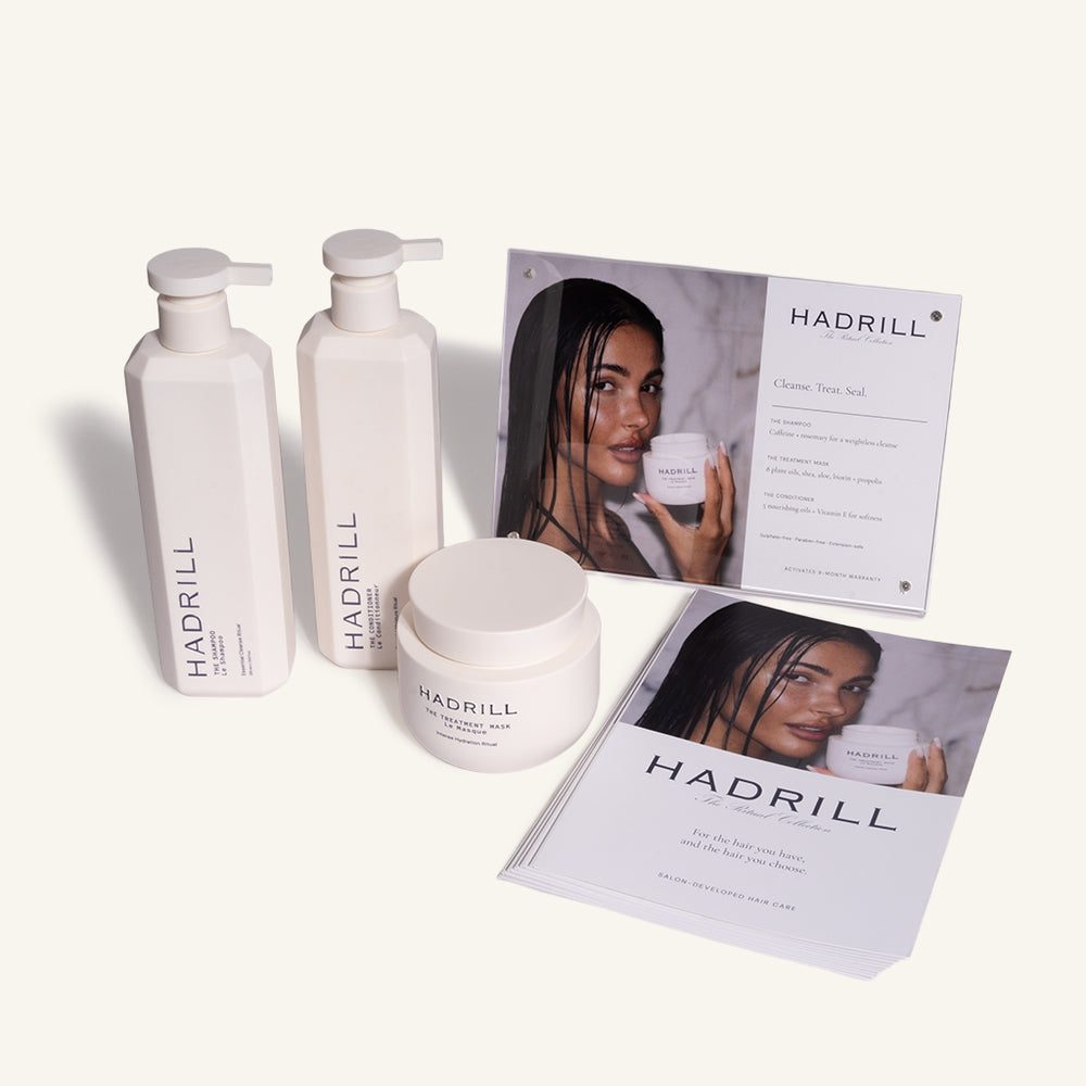 Hadrill Signature Ritual Opening Parcel with unboxed shampoo, conditioner, treatment mask and salon merchandising materials