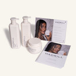 Hadrill Signature Ritual Opening Parcel with unboxed shampoo, conditioner, treatment mask and salon merchandising materials