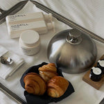 Hadrill Shampoo, Conditioner and Treatment Mask beside breakfast
